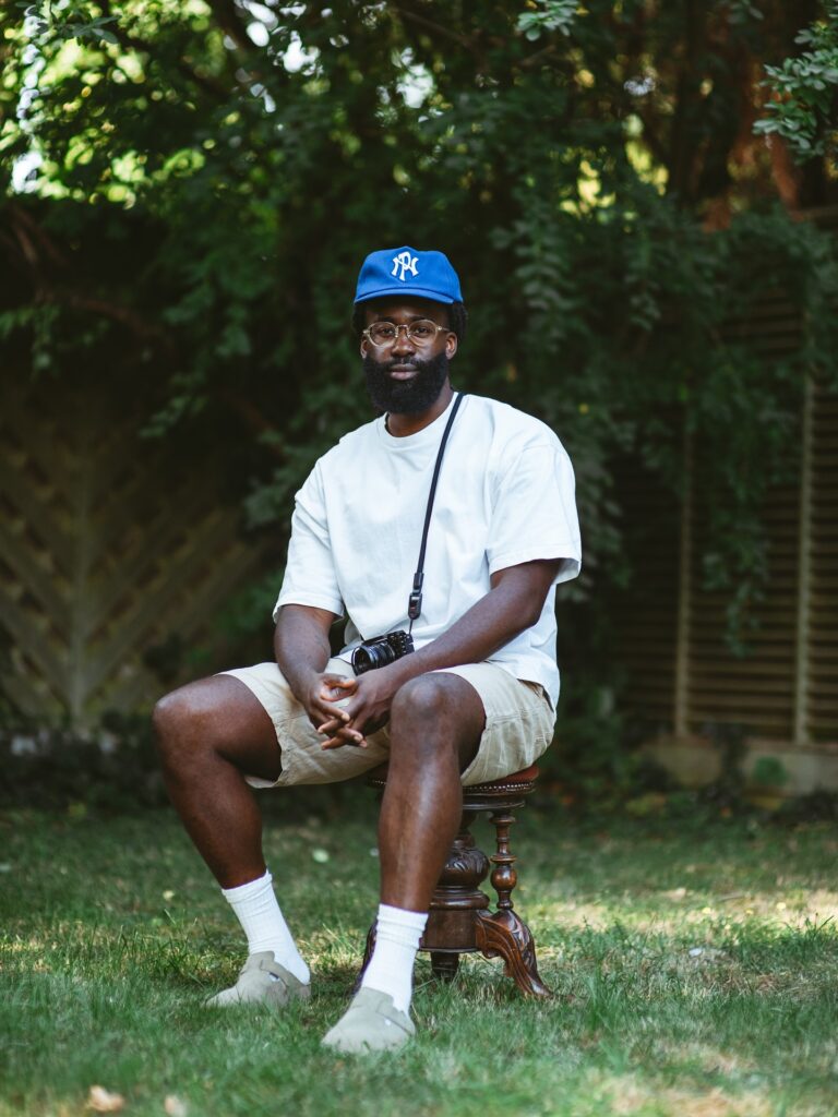 Saheed sitting on a stool